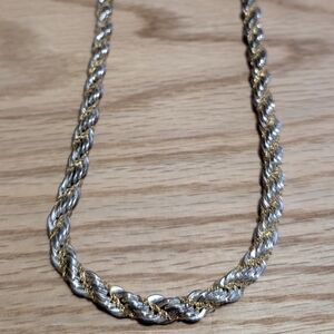 Thick Silver Necklace, w/ smaller gold chain intertwined.